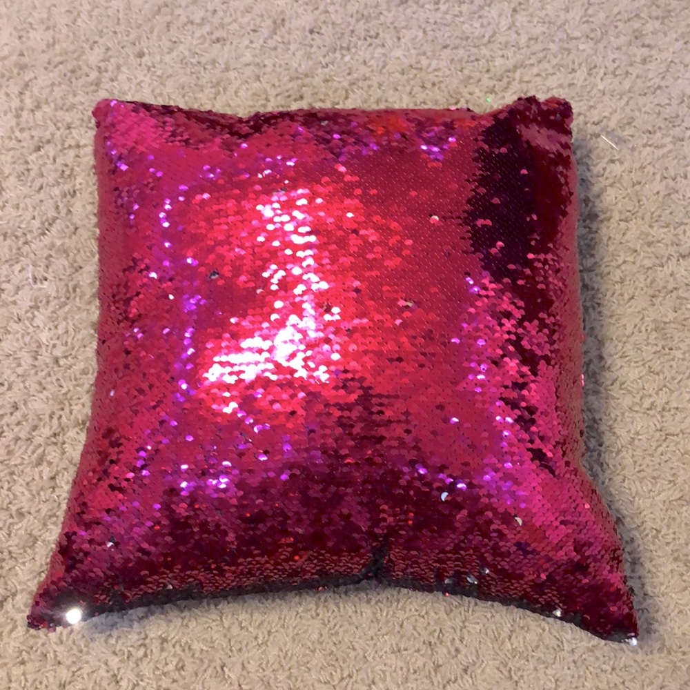 This sequence pink and silver pillow